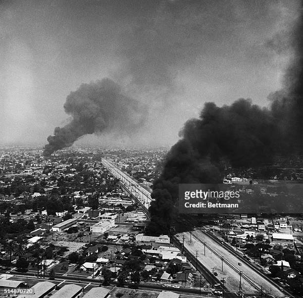 Los Angeles, CA: The War In The West: Black smoke darkens the sky over Southeast Los Angeles, during the fourth day of the six day rioting in the...