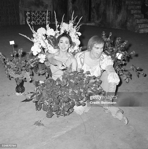 New York, NY: Dame Margot Fonteyn and Rudolf Nureyev frolic among the bouquets of flowers following their performance in the Royal Ballet's...