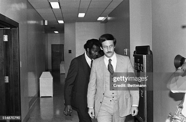 St. Louis, MO: Chuck Berry, the rock 'n' roller who influenced musicians from the Beatles to the Beach Boys, follows one of his attorneys in to court...