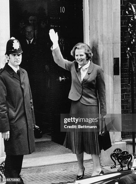 London, England: Britain's Prime Minister Mrs. Margaret Thatcher waving from the steps of 10 Downing Street as she arrived officially to take up...