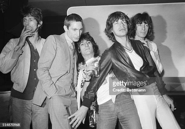 The Rolling Stones, Keith Richards, Charlie Watts, Ron Wood, Mick Jagger, and Bill Wyman ham it up for journalists at a party to promote their new...