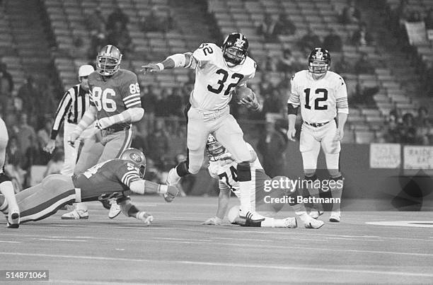 Candelstick Park: After a handoff from QB Terry Bradshaw Franco Harris hits a gaping hole in the 49ers line eluding the grasp of linebacker Ed...