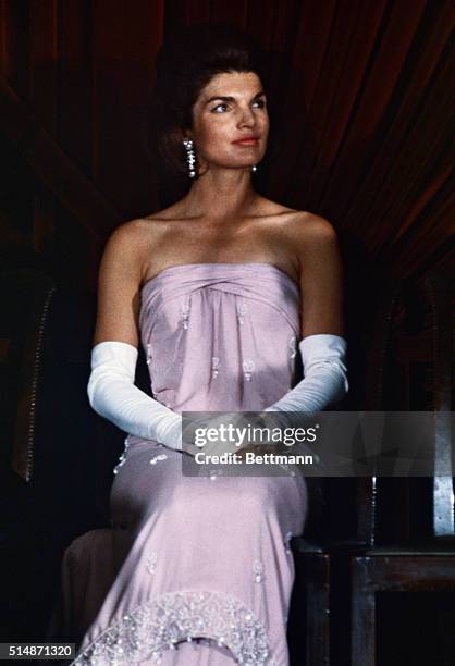 Washington, D.C.: Unveiling ceremonies at National Gallery of Art. Closeup of First Lady Jacqueline Kennedy in a strapless evening gown and elbow...