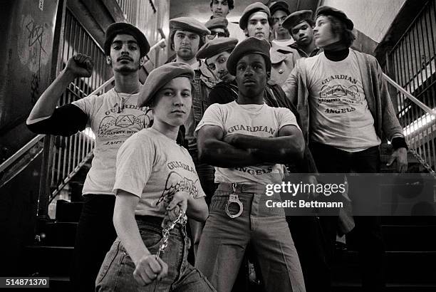 New York, NY: A team of "Guardian Angels" meets on subway stairs as they get ready to go on patrol in part of the city's 230-mile subway system. The...