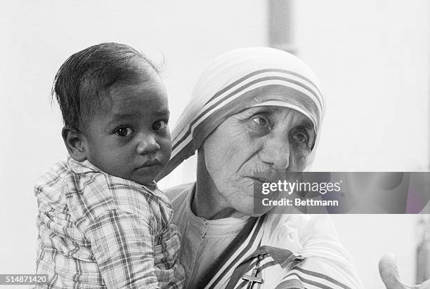 Mother Teresa, who was recently announced as the winner of the 1979 Nobel Peace Prize, holds a young boy from a Calcutta orphanage. The Roman...