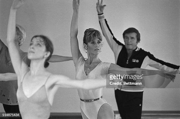 Hollywood, CA: Actress Jane Fonda goes through some ballet exercise with talk show narrator Mike Douglas during taping of the "Mike Douglas Show"...