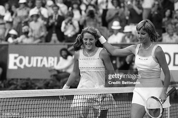 New York, NY: A gracious Chris Evert Lloyd pats Tracy Austin on the head after Austin dethroned the four-time champion, 6-4, 6-3 in 90 minutes to win...