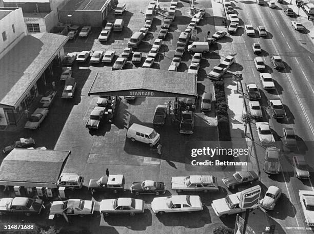 Motorists line up for gas on the first day of gas rationing imposed on nine California counties following the revolution in Iran that caused a...