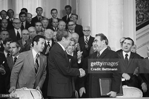 Moscow, Russia: President Richard Nixon and Soviet Party Leader Leonid I. Brezhnev are all smiles as they shake hands at the Kremlin after signing a...