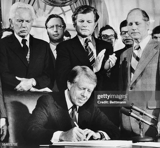 Washington, DC: President Carter signs the airline deregulation bill at the White House to begin phasing out federal control of the nation's...