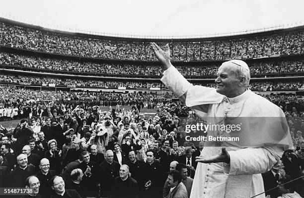 New York, NY: Shea Stadium: Pope John Paul II acknowledges the cheering of the crowd here 10/3.