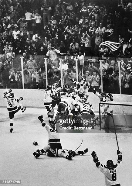 Lake Placid, NY: In a scene of wild jubilation, American Olympic hockey players celebrate their upset 4-3 victory over the Soviet Union in the...