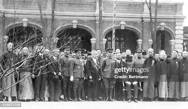 Japan: Surrrounded by dignataries, Henry Pu-Yi, former boy emperor of Japan, is seen seated at Changchun, after the inaugural ceremonies which made...