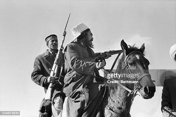 Near Herat, Afghanistan: Afghan rebels snipe at Soviet-held positions near Herat. The rebel raiding party, travelling by motorcycle and horseback,...