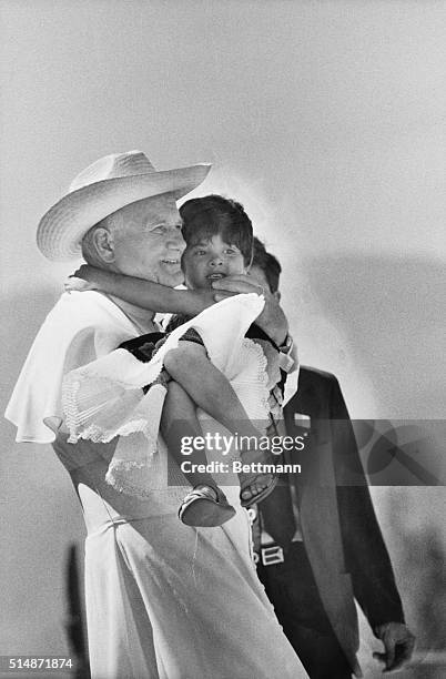 Cuilapan, Mexico: Wearing a cowboy-style straw hat, Pope John Paul II holds a small child while visiting the Indian vilage of Cuilpan January 29....