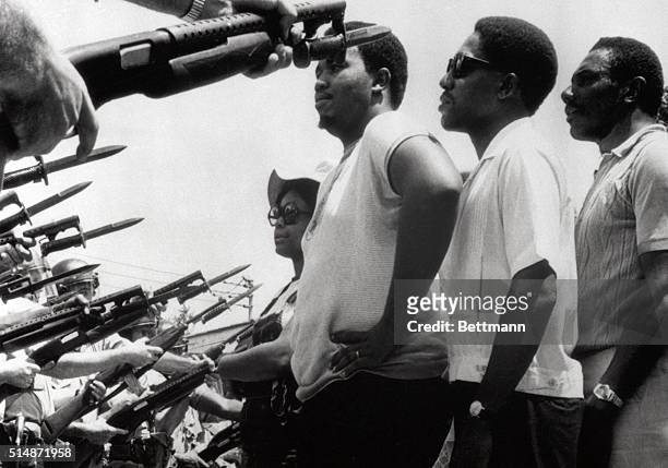 Prichard, AL: Leaders of a march of about 255 persons stare at police officers who stopped the predominately Negro group from marching on city hall....