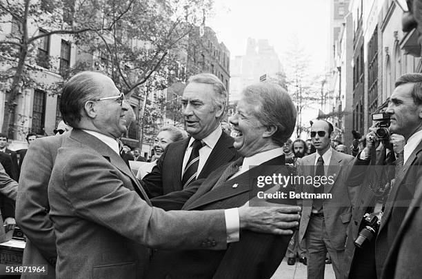 Israeli Prime Minister Menachem Begin and American President Jimmy Carter embrace during an unscheduled meeting on a Manhattan sidewalk. There has...