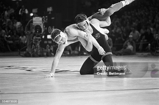 Larry Owings of Washington breaks hold and flips Dan Gable of Iowa State during the final match in the 142-pound class of the NCAA Wrestling...