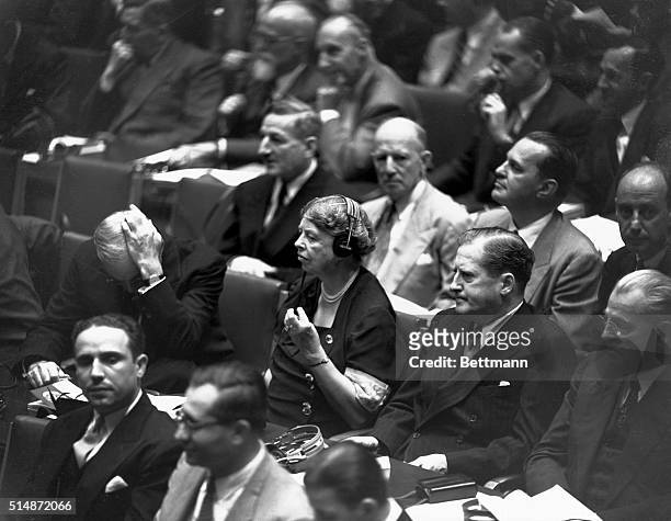 Eleanor Roosevelt, widow of President Roosevelt, is shown as a member of the United States delegation listening to the proceedings at the opening of...