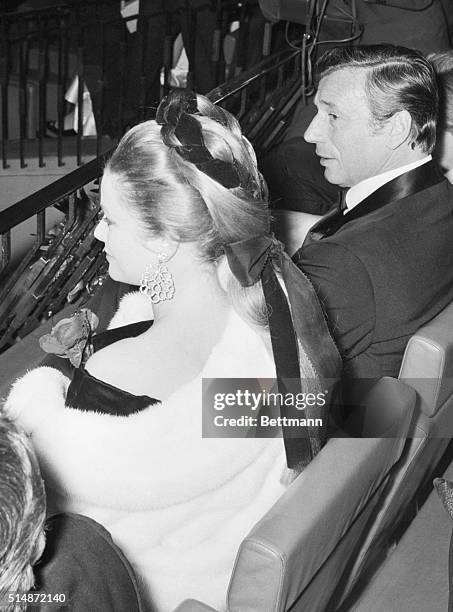 Ribbons intertwined with a long "fall" was the setting for a hairdo worn by Princess Grace of Monaco when she attended the premiere of "Grand Prix,"...