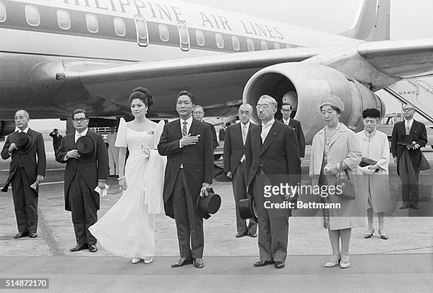 The Philippine President Ferdinand E. Marcos and his wife Imelda, at left, salutes with Japanese Emperor Hirohito and Empress Nagako as the...