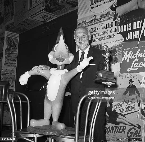 Hollywood:"Woody Woodpecker" points to a golden statuette of himself that was presented to his creator, Walter Lantz, 5/24 to mark Lantz's 50th...