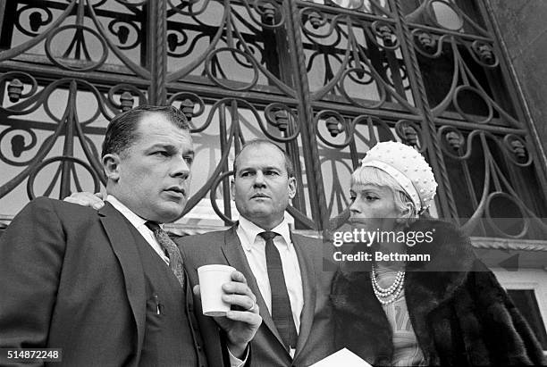 Sam Sheppard stands with his wife Arian and his attorney F. Lee Bailey after his second trial for the murder of his first wife over ten years earlier.