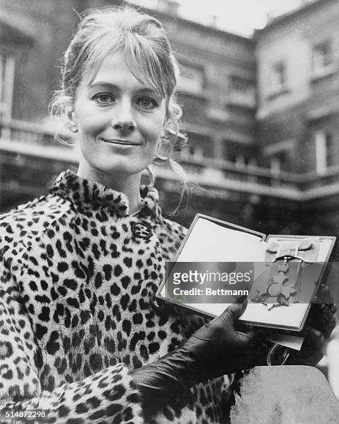 Seen leaving Buckingham Palace is actress Vanessa Redgrave, holding the C.B.E. , which she was awarded at the Feb. 13 investiture. She is the second...
