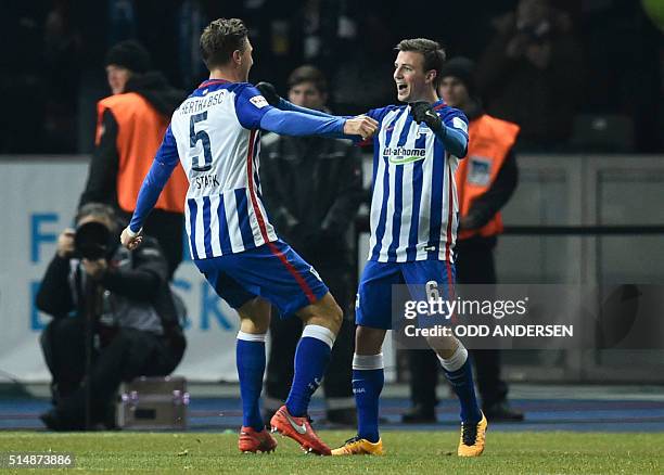 Hertha's midfielder Niklas Stark celebrates scoring the 2-0 goal with his team-mate Czech midfielder Vladimir Darida during the German first division...