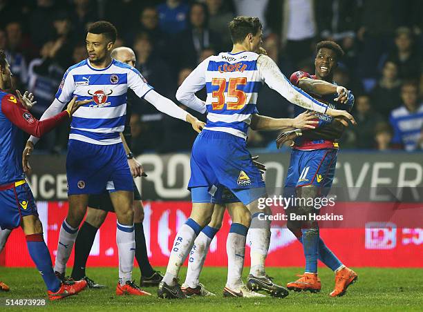 Wilfried Zaha of Crystal Palace and Jake Cooper of Reading clash during the Emirates FA Cup sixth round match between Reading and Crystal Palace at...