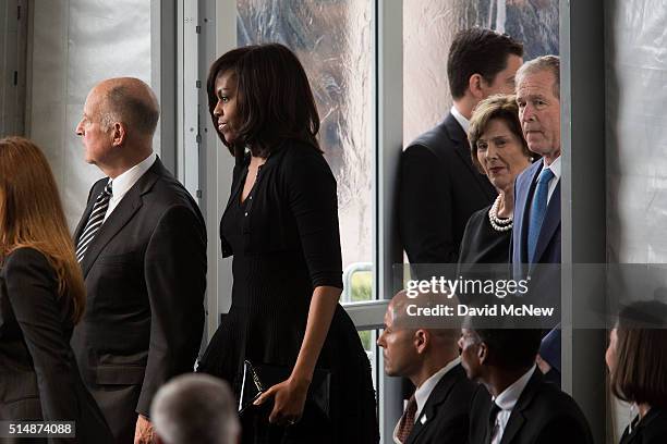 First lady Michelle Obama arrives with California governor Jerry Brown and former President George W. And Laura Bush to funeral and burial services...