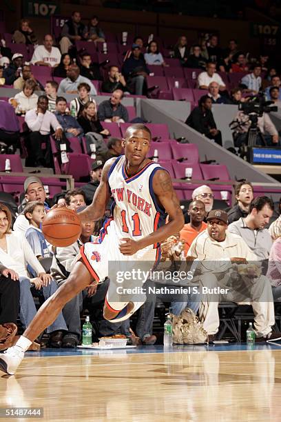 Jamal Crawford of the New York Knicks dribbles against San Antonio Spurs during a preseason game on October 16, 2004 at Madison Square Garden in New...