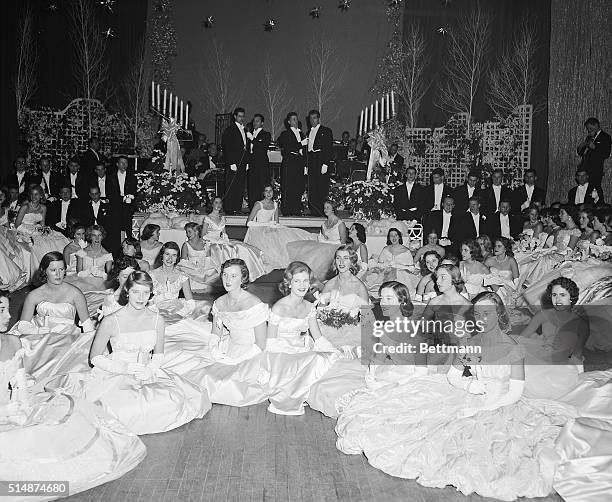 New York: The annual debutante cotillion and Christmas ball was held at the Waldorf-Astoria tonight. Under the glow of a pink satin canopy and the...