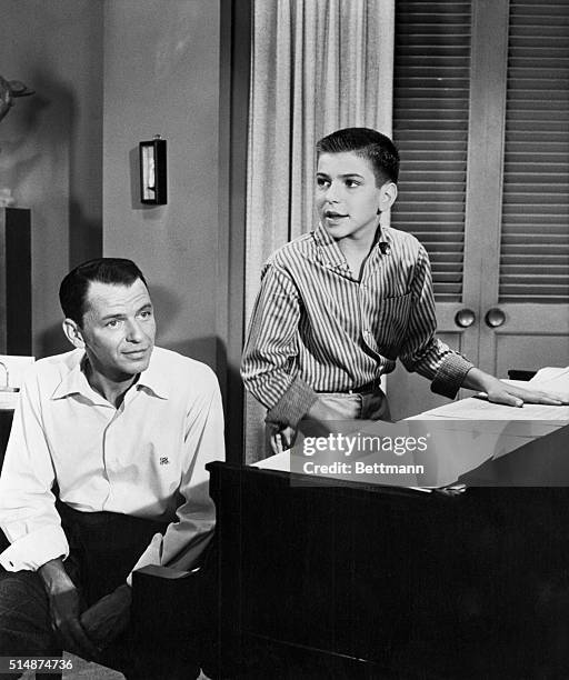 Hollywood, CA: Frank Sinatra is shown in rare photograph with his son Frank Sinatra Jr., 14 as they rehearsed for a forthcoming Frank Sinatra Show."...