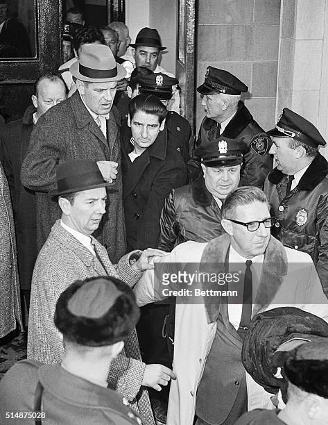 Albert DeSalvo, the Boston Strangler, is escorted out of Lynn Police Station to be taken to Walpole State Prison. He was captured in a West Lynn...