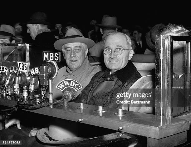 Washington, DC: Photo shows President Roosevelt as he made a short radio talk upon his arrival "home" in Washington. Photo shows left to...