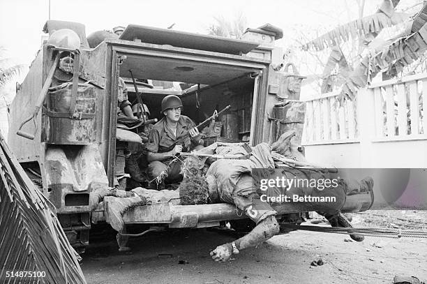 The bodies of US soldiers lay on the back of an armored personnel carrier which moved through the fighting near Tan Son Nhut Airbase to pick up the...