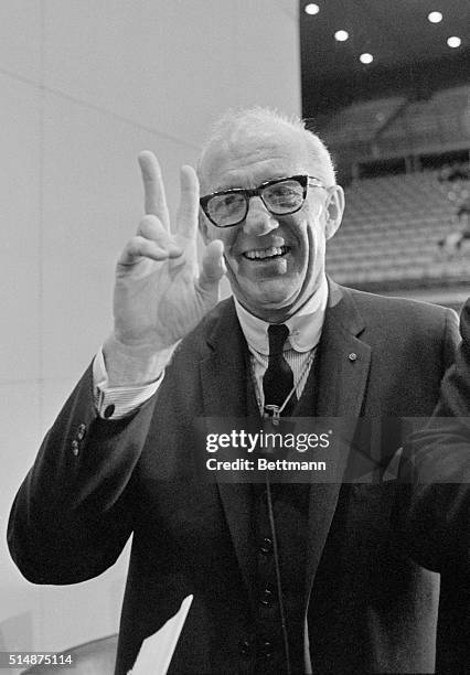 Pediatrician Dr. Benjamin Spock smiles and shows the finger sign for peace. Dr. Spock is author of the best selling child development book Common...