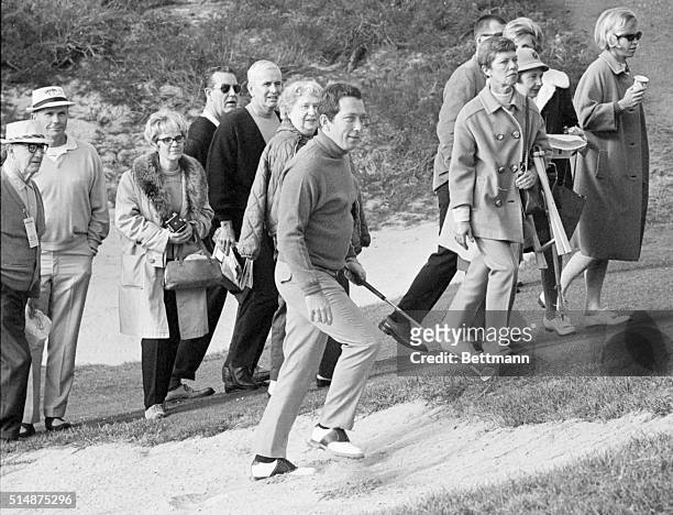 Spectators watch singer Andy Williams compete in the pro-amateur portion of the Bing Crosby Golf Classic at Pebble Beach, California. January 19,...