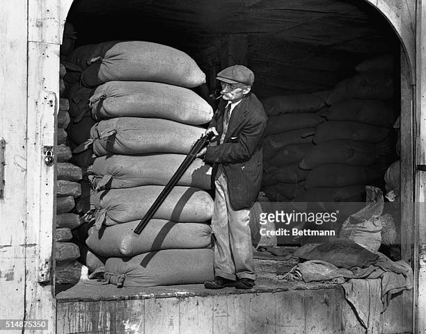 Grovers Mill, NJ, 10/31/38: William Dock stands ready with his trusty shotgun to ward off the attack of any strange creatures from Mars, who were...