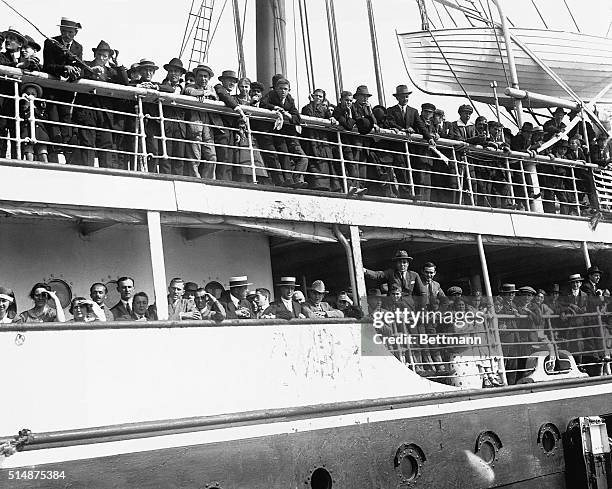 New quota laws delay a ship of immigrants waiting to dock in New York. Ship is the S.S. Aquitainia.