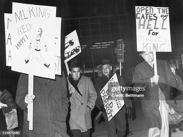 Members of the right-wing organization break through picket outside Cobe Hall in dissent of Rev. Martin Luther King who addressed a dinner inside.