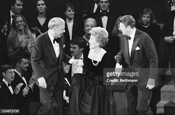 Landover, Maryland: President-elect and Mrs. Ronald Reagan are brought to the stage by Frank Sinatra following the inaugural gala honoring the...
