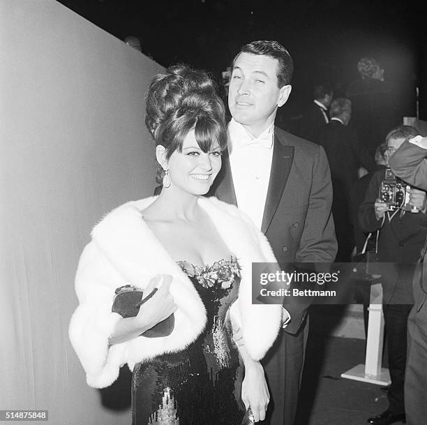 Santa Monica, California: Actor Rock Hudson escorted actress Claudia Cardinale to the gala presnetations of the highest artistic honor in the film...