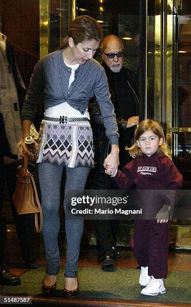 Celine Dion leaves for the airport from a midtown hotel with her husband Rene Angelil and their son Rene Jr. October 16, 2004 in New York City.