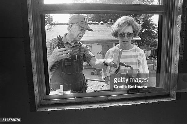 Former President Jimmy Carter and former first Lady Rosalynn Carter work at a Habitat for Humanity site in Atlanta, building houses for working poor...