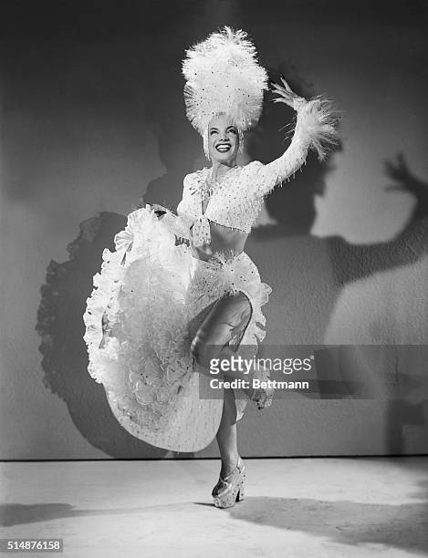 Carmen Miranda dances in the film You're For Me, wearing a showy costume, made completely out of plastic. The dress was made for $1900, with most of...