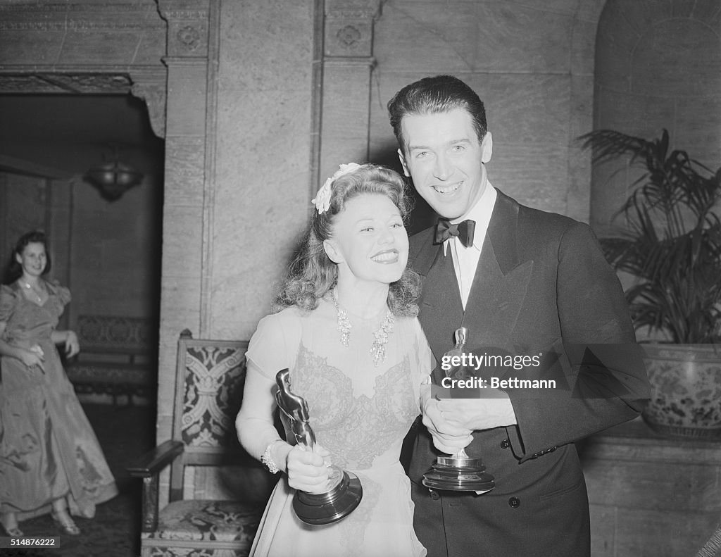Ginger Rogers and Jimmy Stewart Holding Oscars