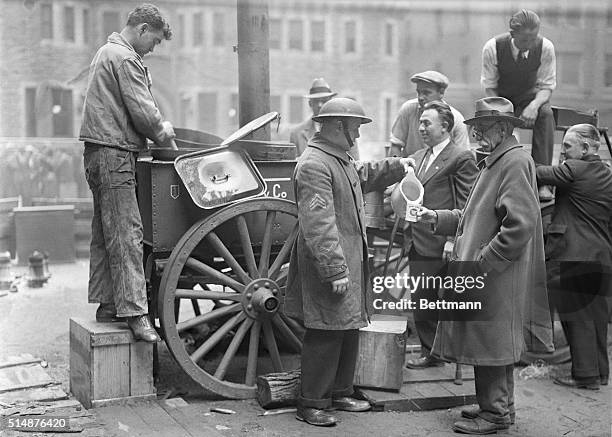 War Veterans, members of the old 307th. Ionfantry. Photo shows Sergt. Ray McMahon, being aided by the veterans who volunteered their services.