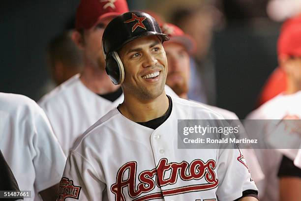 Carlos Beltran of the Houston Astros smiles in the dugout after hitting a solo home run in eighth inning of Game 3 of National League Championship...